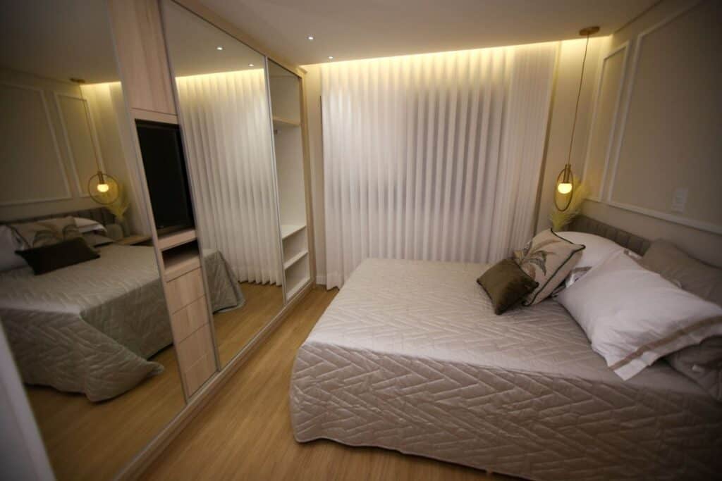 A calm, softly lit modern bedroom with a neatly made bed